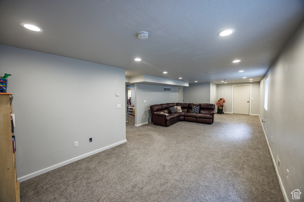 Living room featuring recessed lighting and carpet flooring