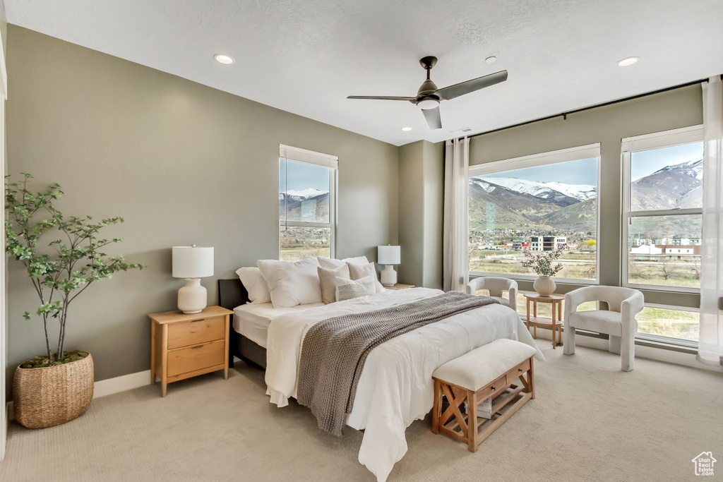 Bedroom with baseboards, ceiling fan, recessed lighting, and light colored carpet