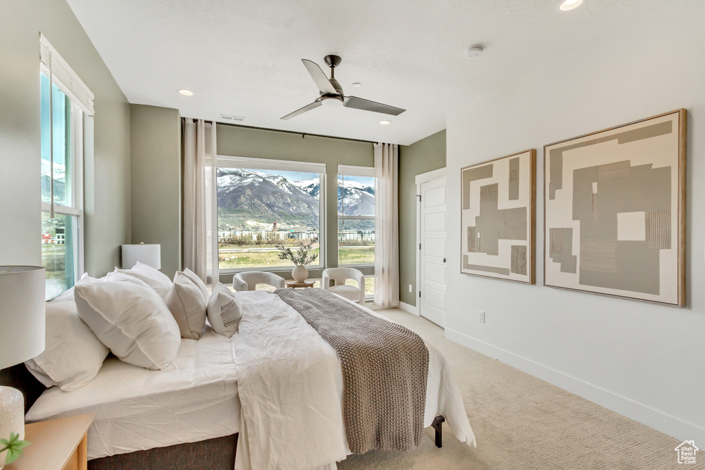 Bedroom with baseboards, recessed lighting, ceiling fan, and light carpet