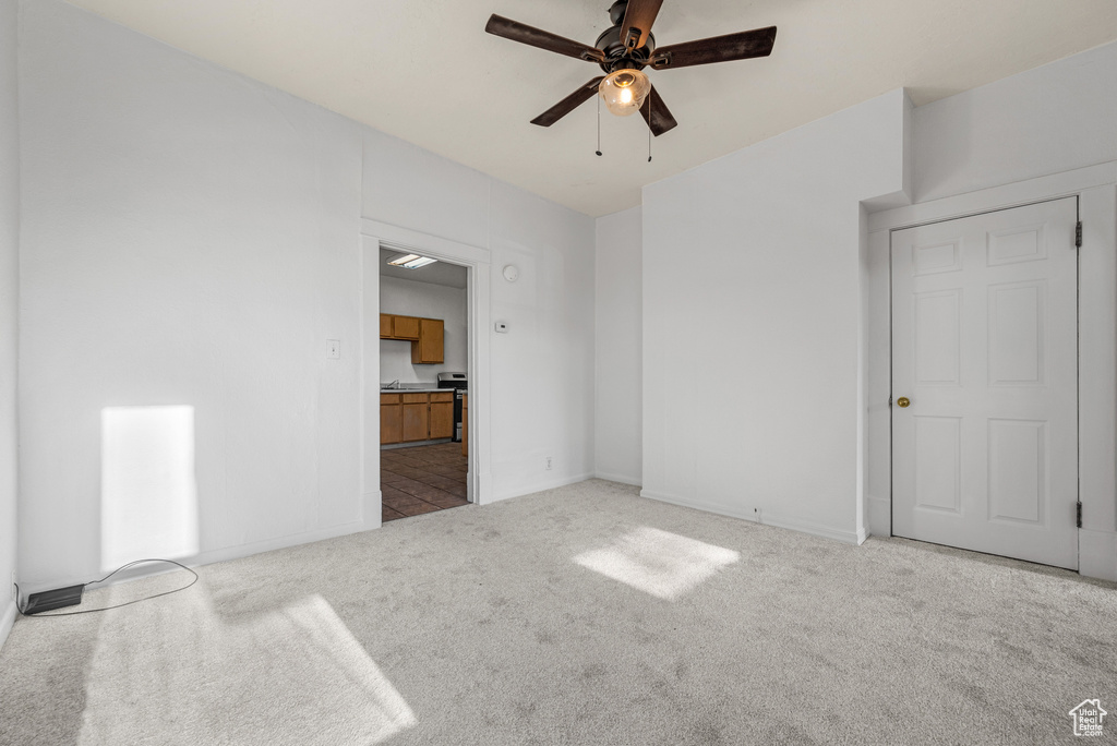 Unfurnished bedroom featuring carpet floors and baseboards