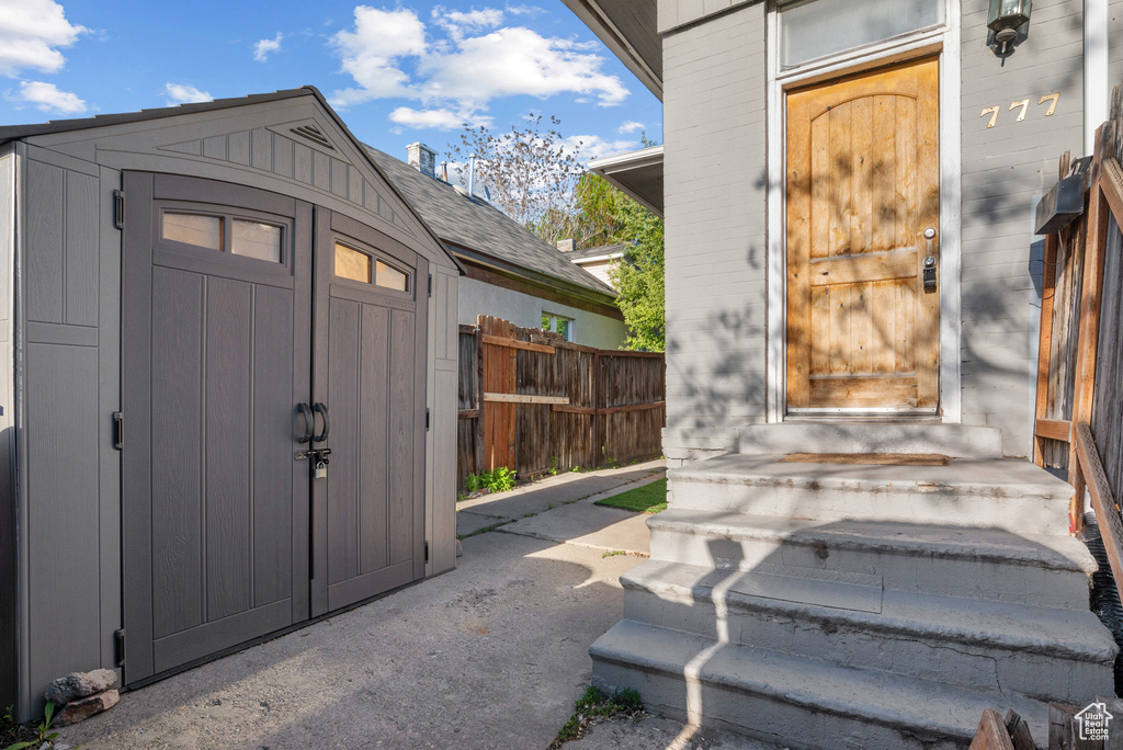 Property entrance featuring fence