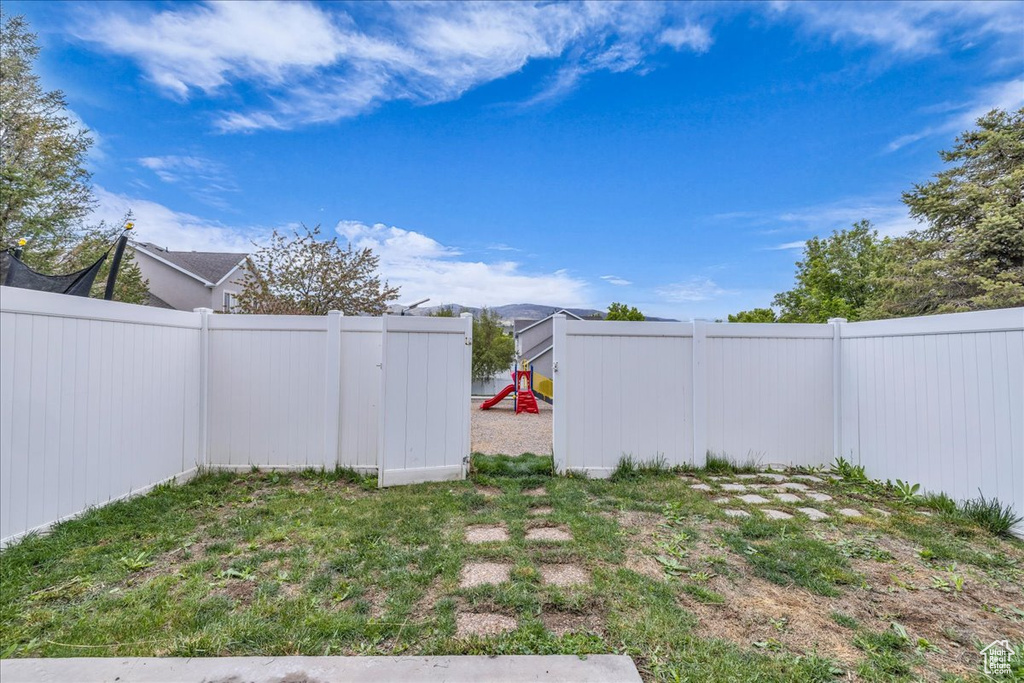 View of yard with a fenced backyard