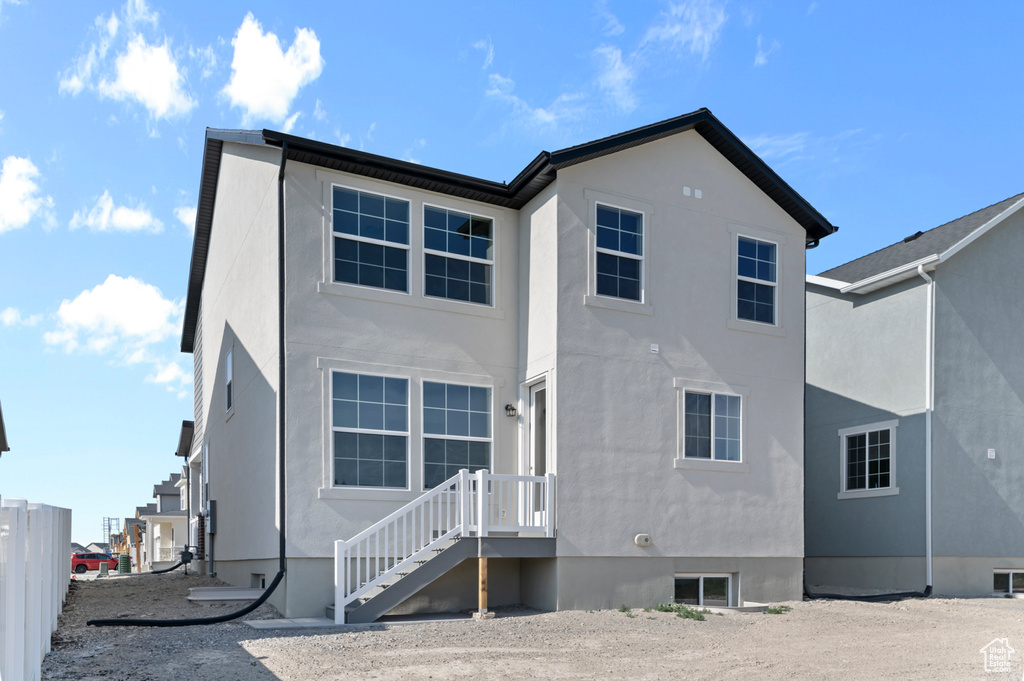 Back of property with stucco siding