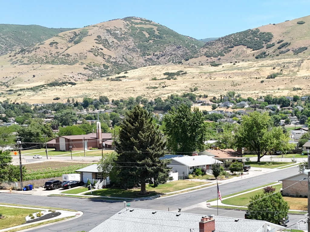 View of mountain background featuring nearby suburban area