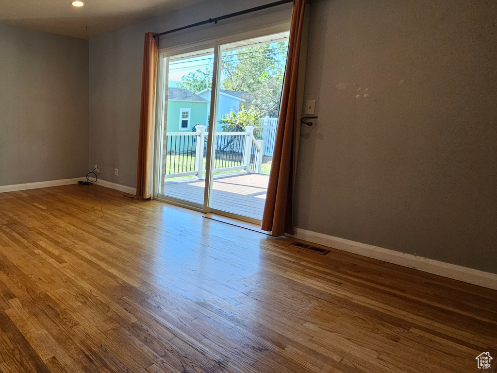Spare room featuring wood finished floors and recessed lighting
