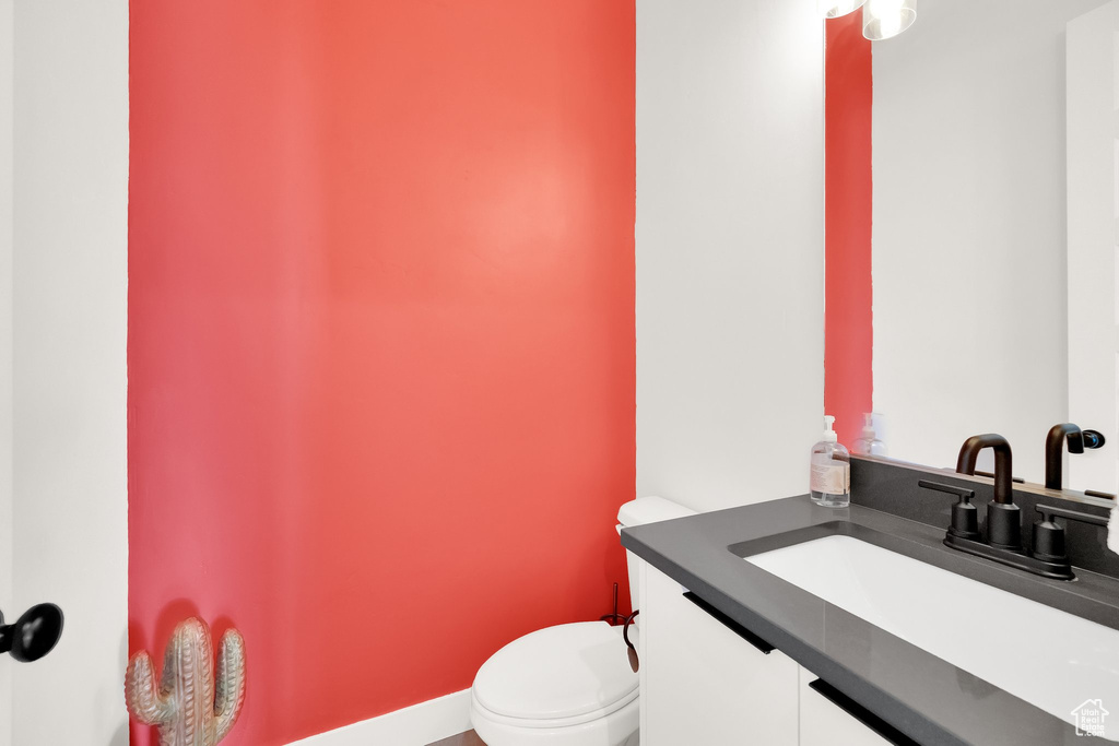 Bathroom featuring vanity and toilet