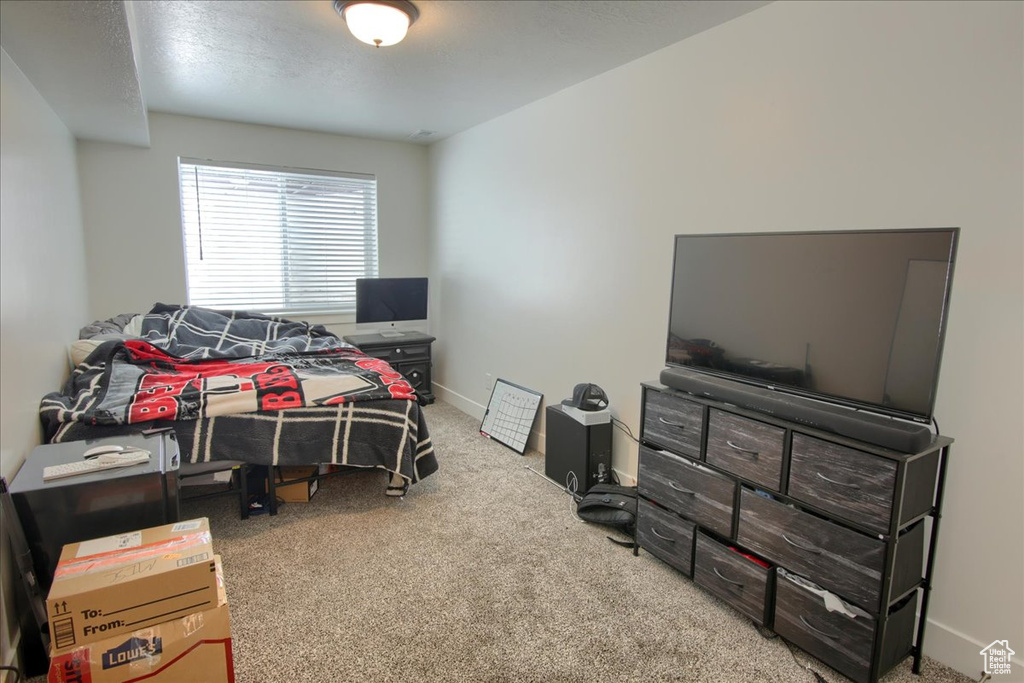 Carpeted bedroom with baseboards