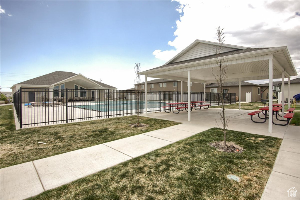 Pool featuring a yard and fence