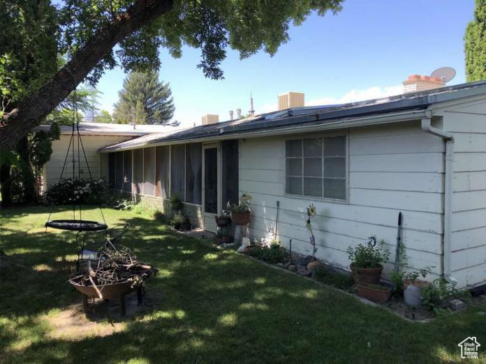Exterior space featuring a yard