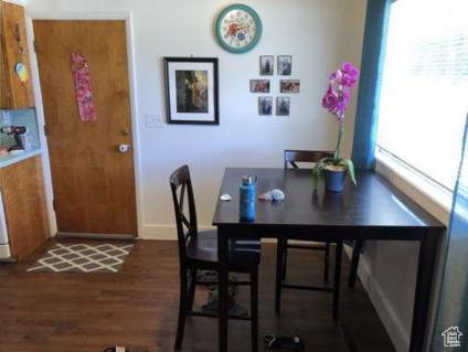 Dining area featuring baseboards and wood finished floors