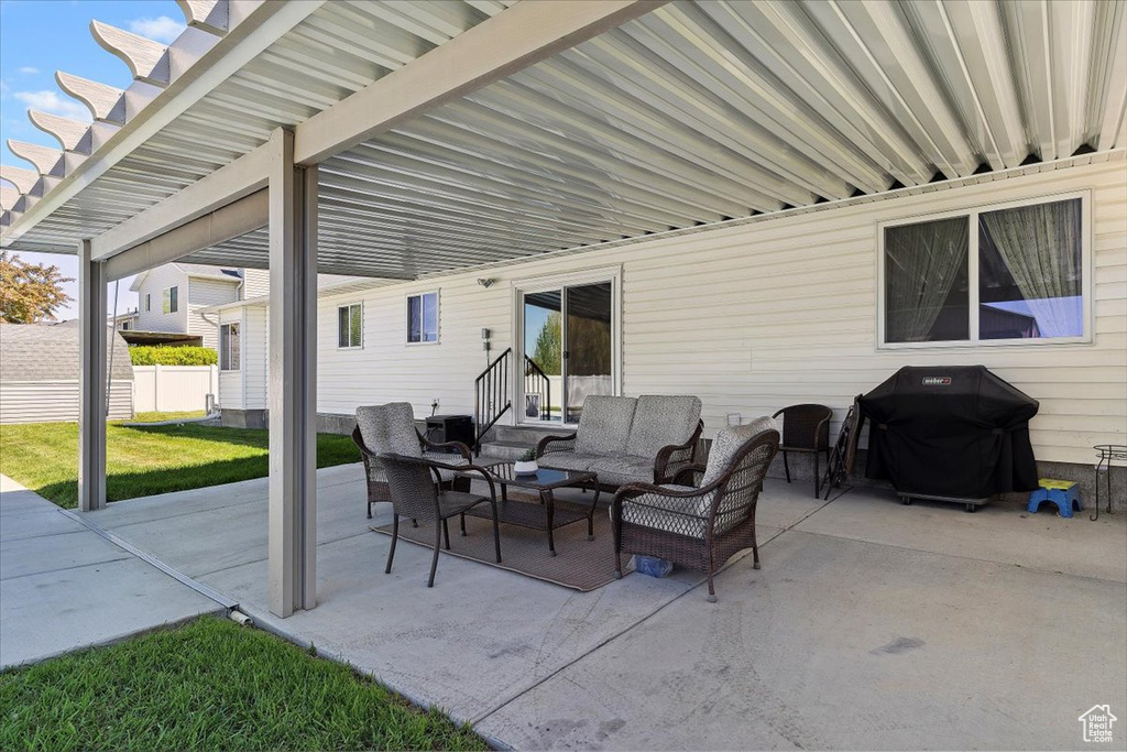 View of patio featuring an outdoor living space and grilling area