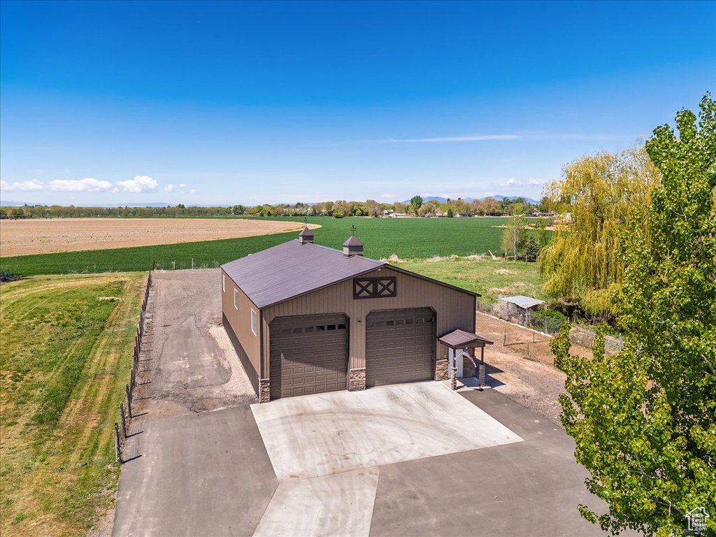 Exterior space featuring a rural view and fence