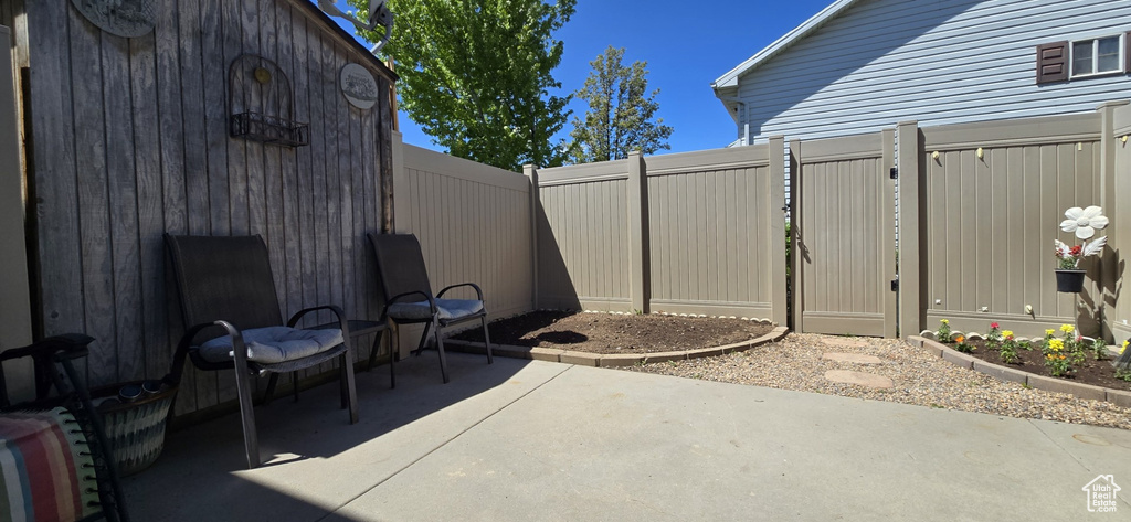 View of patio with a fenced backyard