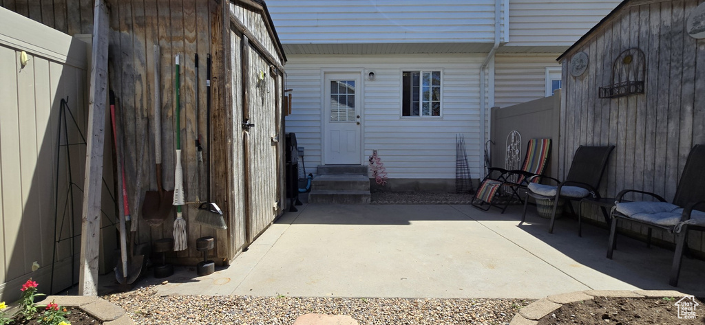 View of patio / terrace with entry steps and fence