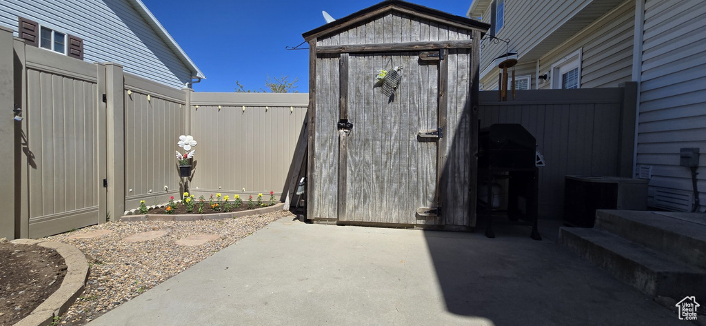 View of outbuilding featuring a fenced backyard