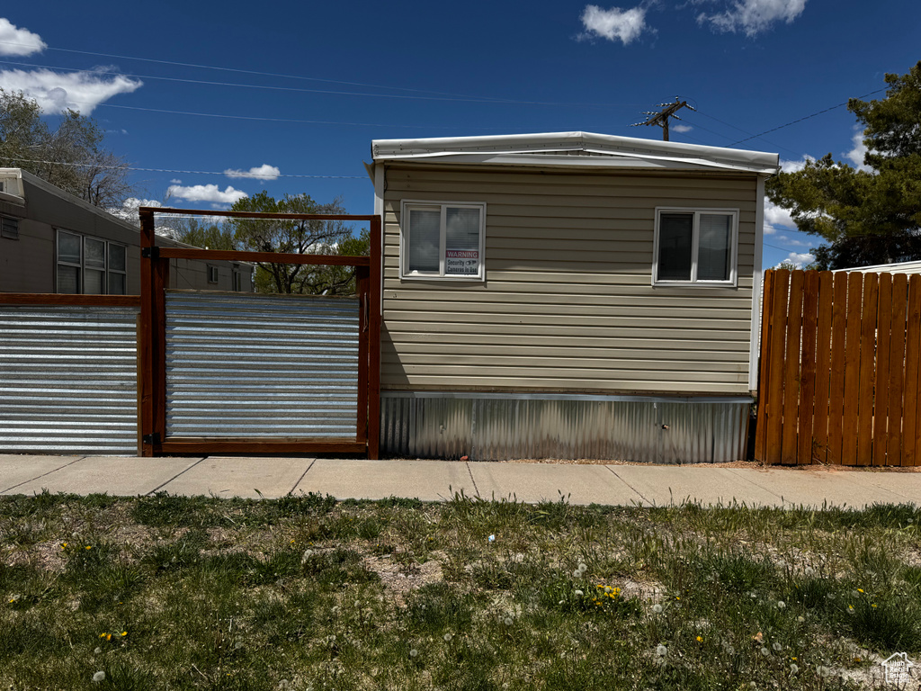 View of property exterior with fence