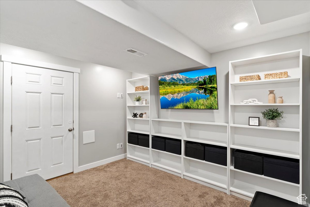 Unfurnished living room with visible vents, carpet flooring, baseboards, and recessed lighting