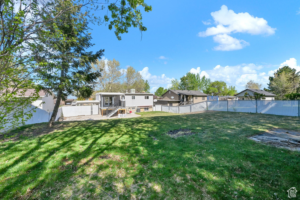 View of yard with a fenced backyard