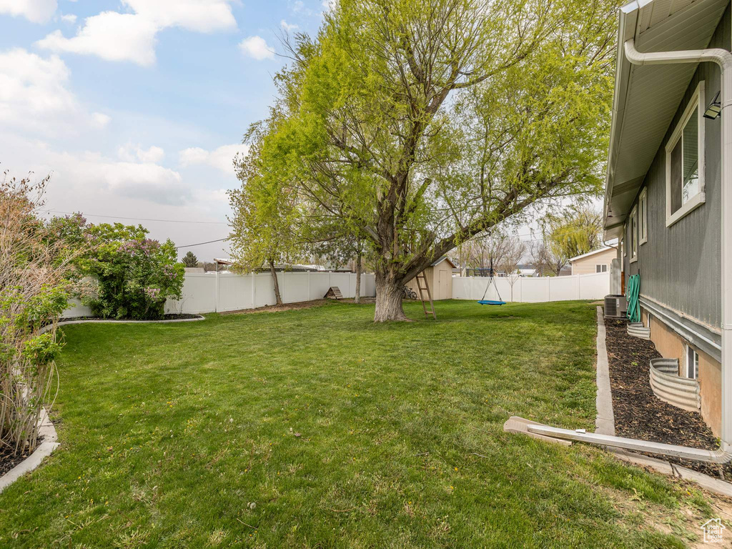 View of yard with a fenced backyard