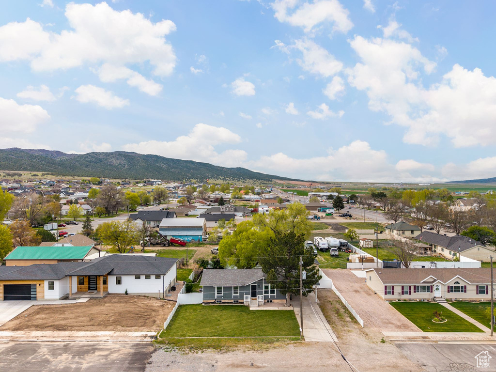 Drone / aerial view with a residential view and a mountain view