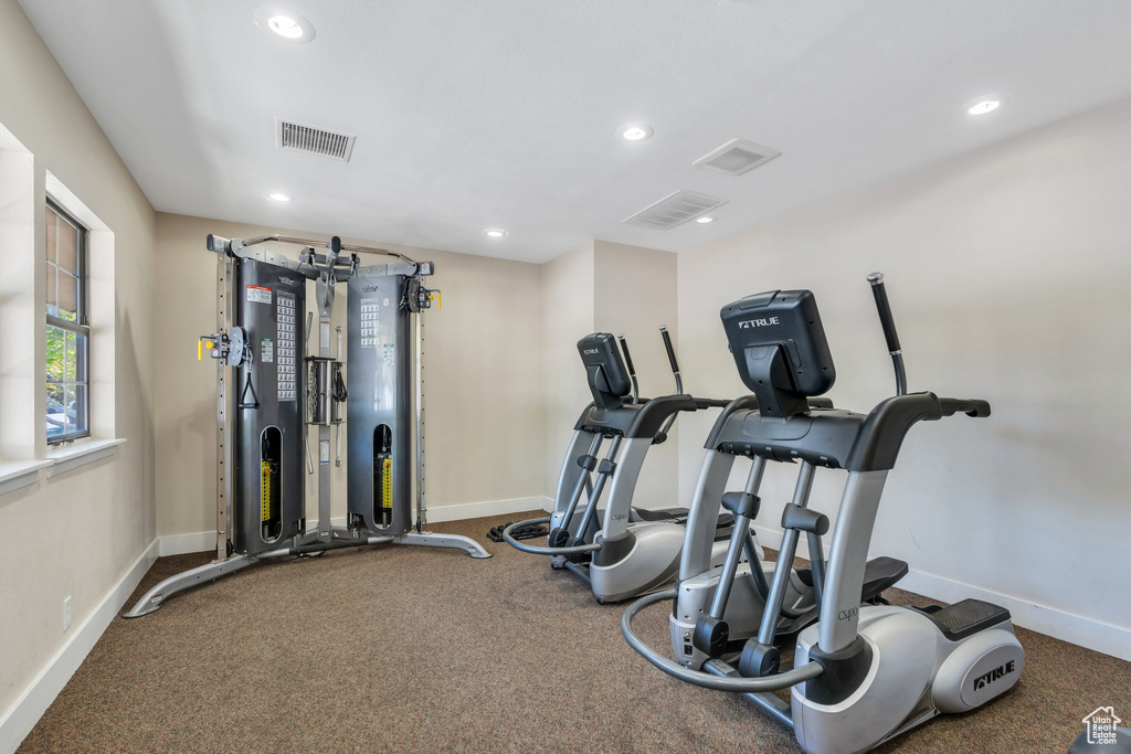 Workout area featuring recessed lighting, baseboards, and visible vents