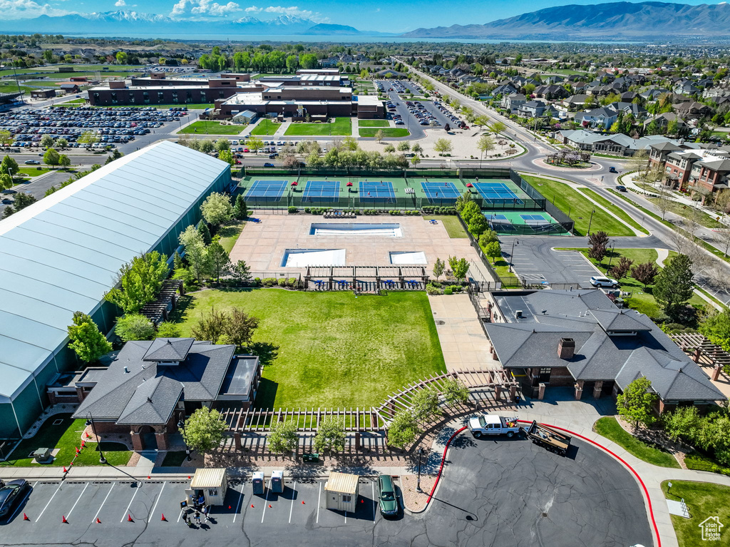 Birds eye view of property with a mountain view and a residential view