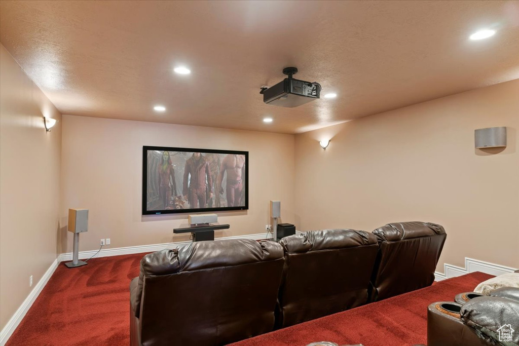 Cinema featuring recessed lighting, baseboards, and dark colored carpet