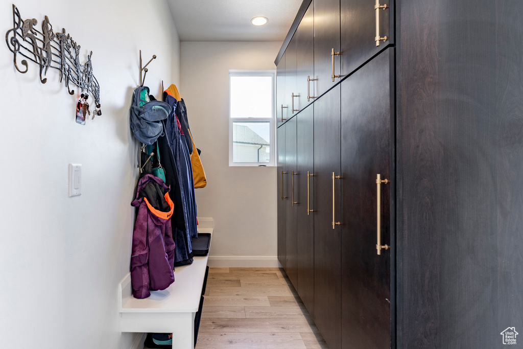 Mudroom featuring recessed lighting, baseboards, and light wood-style floors