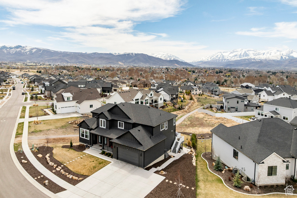 Birds eye view of property with a residential view and a mountain view
