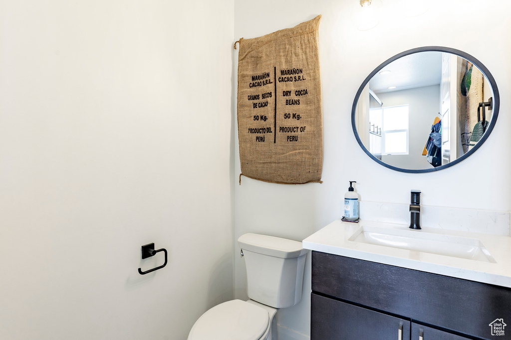 Half bath with vanity and toilet