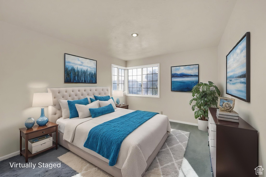 Carpeted bedroom with baseboards