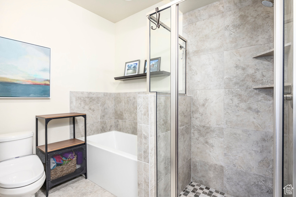 Bathroom with a stall shower and a bath