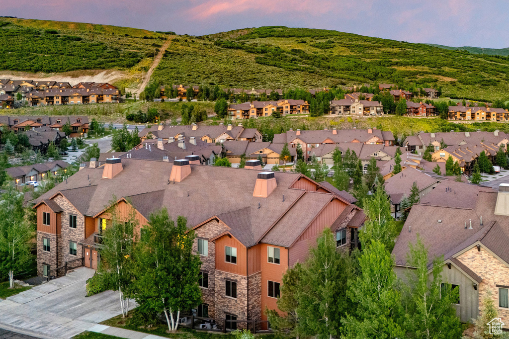 Aerial view of residential area with a mountain backdrop