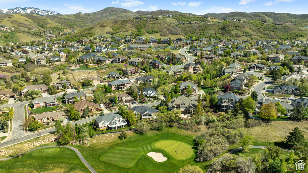 Drone / aerial view with a residential view, a mountain view, and view of golf course