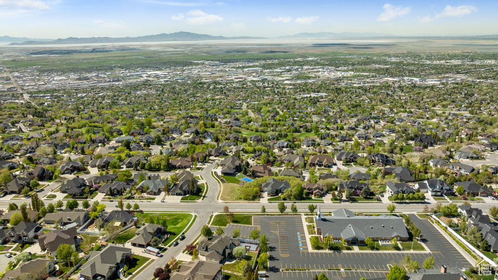 Birds eye view of property with a residential view and a mountain view