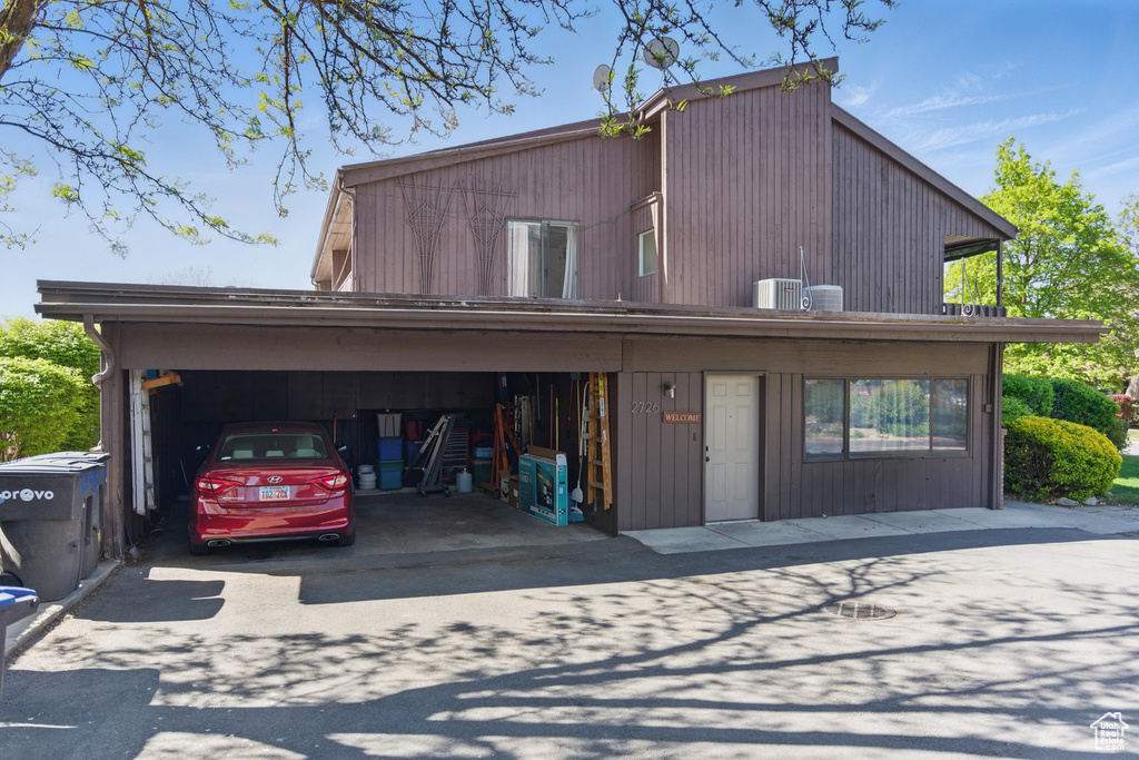 View of front of house featuring central air condition unit