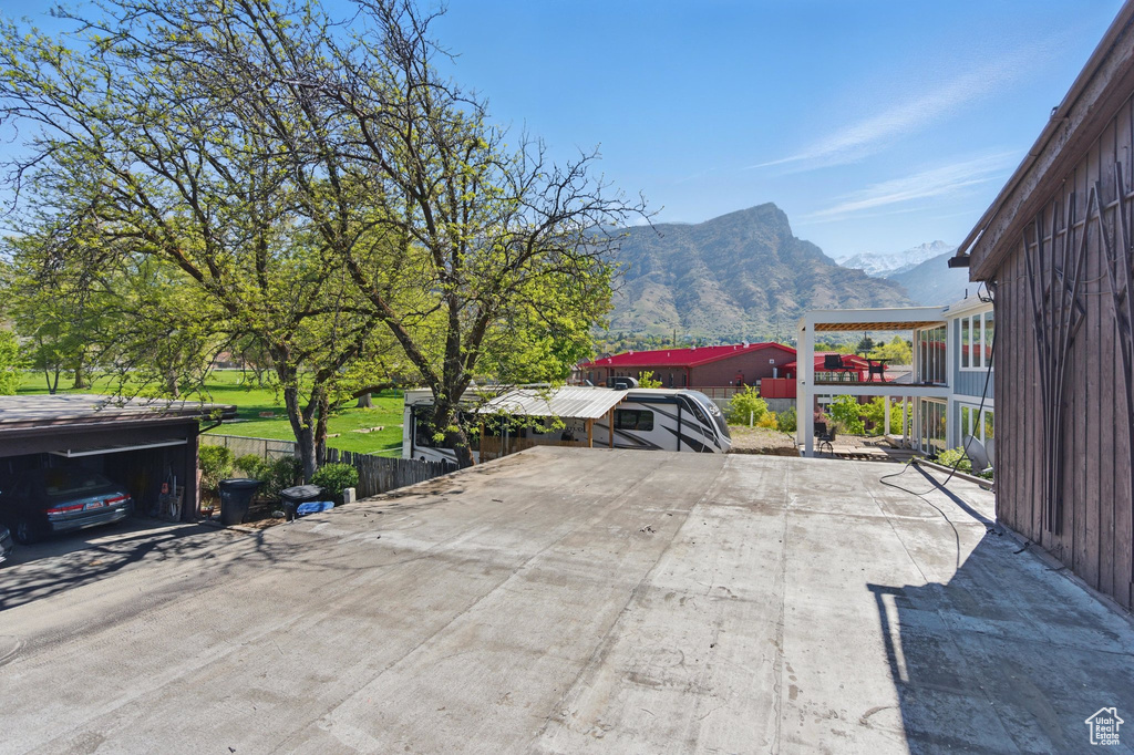 Exterior space with fence and a mountain view