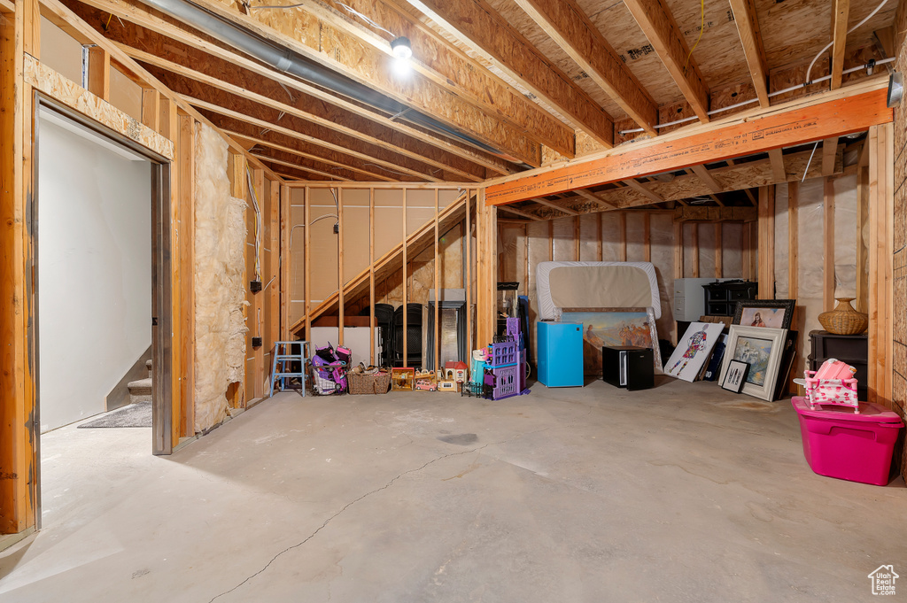 Unfinished basement with stairs