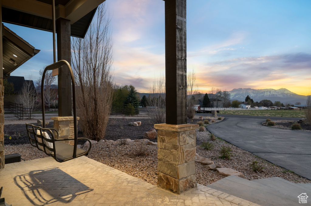View of community with a mountain view and a patio