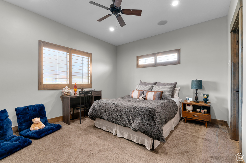Bedroom with light colored carpet, ceiling fan, baseboards, and recessed lighting
