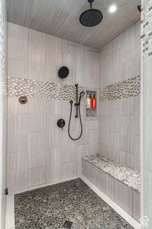 Bathroom featuring recessed lighting and tiled shower