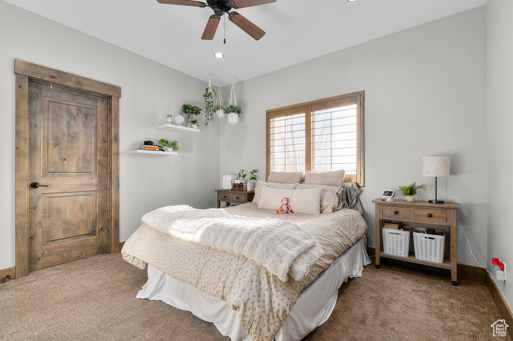 Carpeted bedroom featuring recessed lighting and ceiling fan