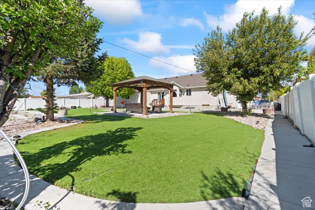 View of yard featuring a patio, a gazebo, and a fenced backyard