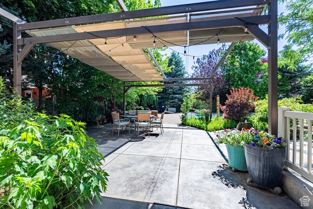 View of patio / terrace with a pergola and outdoor dining area