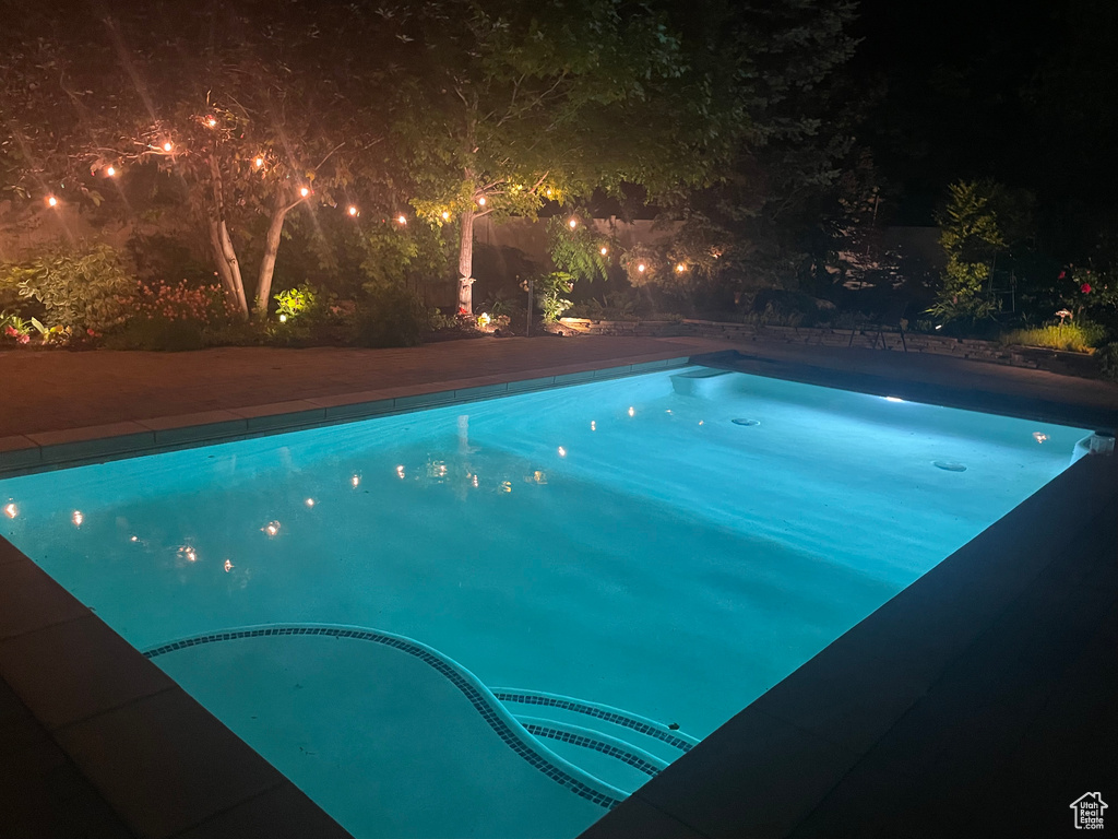 Pool at twilight with an outdoor pool
