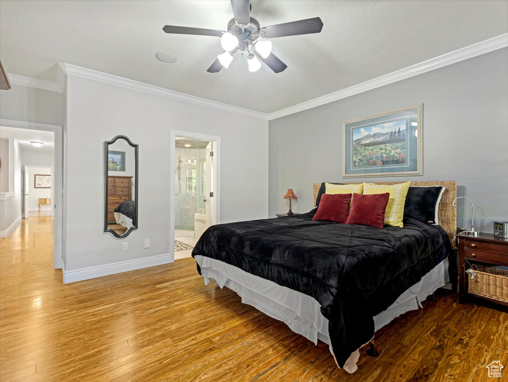 Bedroom featuring crown molding, baseboards, a ceiling fan, and light wood-style flooring