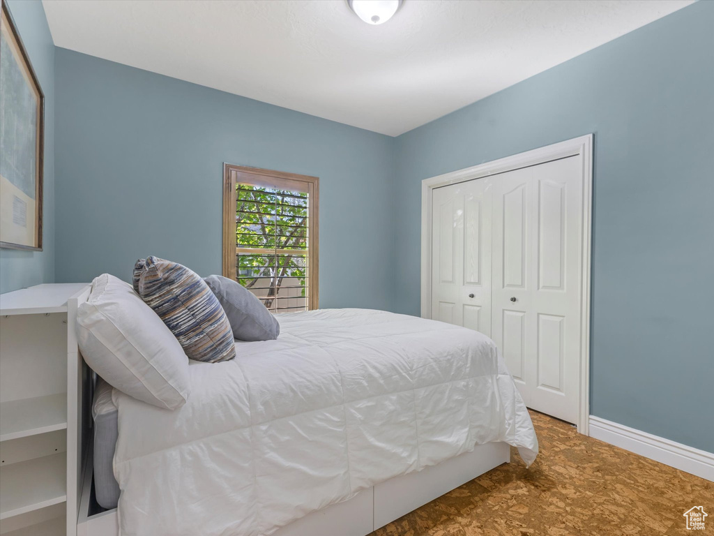 Bedroom featuring baseboards and a closet