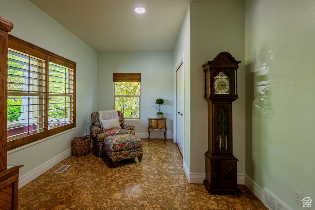 Sitting room featuring baseboards and tile patterned floors