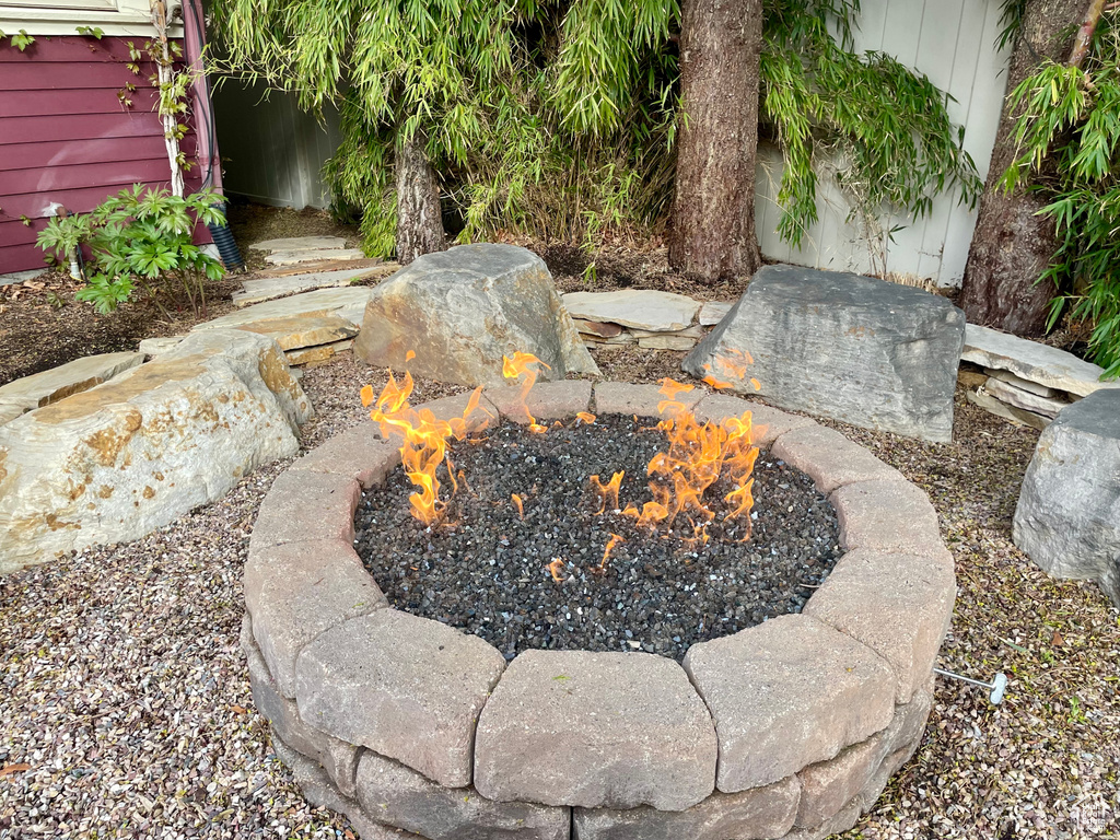 View of yard with a fire pit