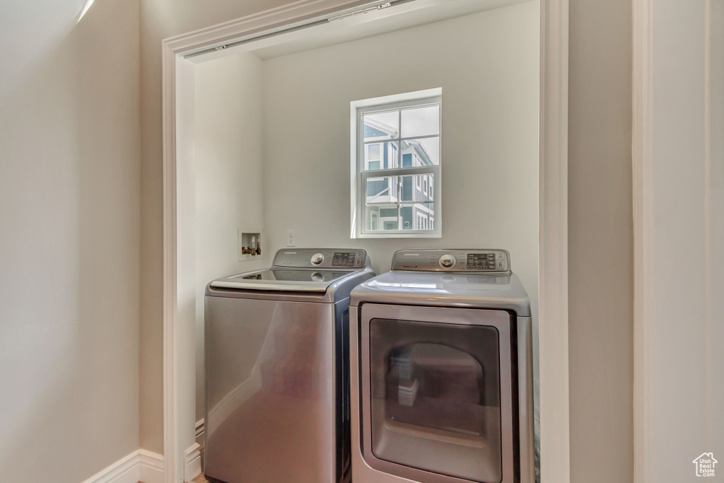 Washroom with laundry area and independent washer and dryer